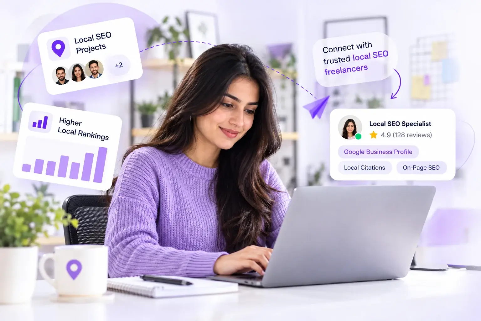 Female local SEO professional working on a laptop in a bright workspace